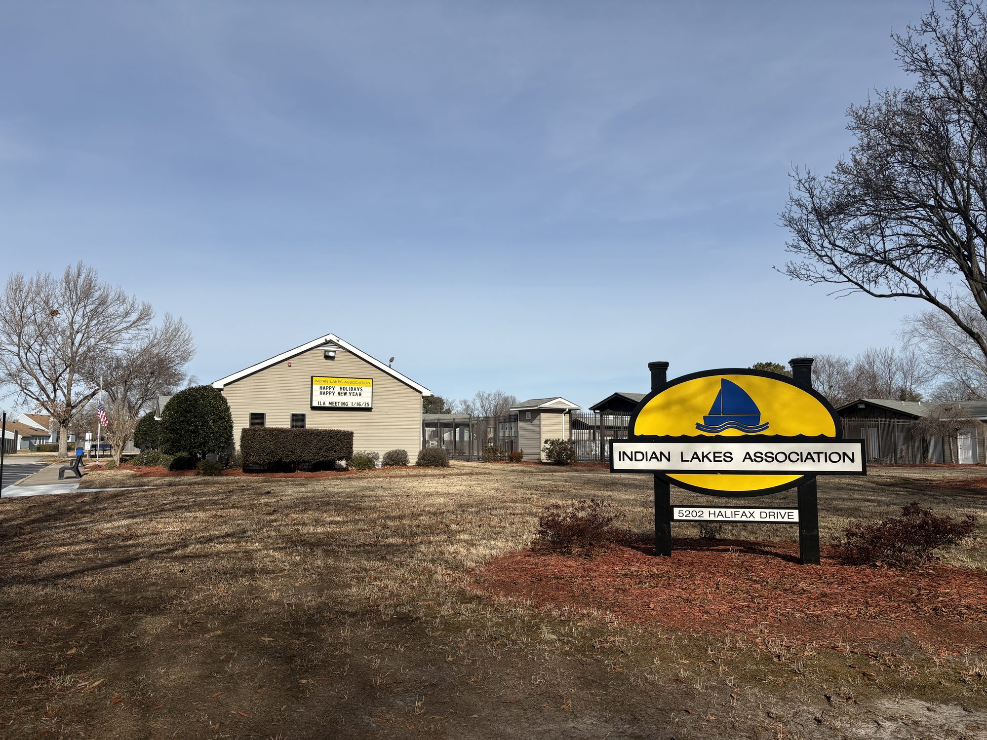 The Indian Lakes clubhouse and entrance sign in Virginia Beach
